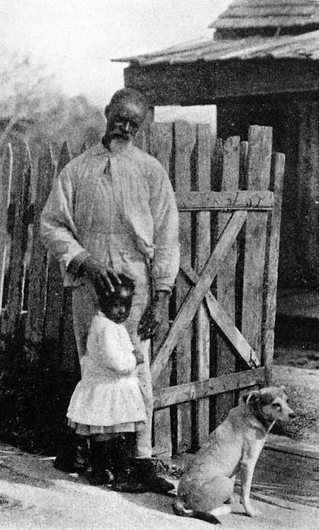 A French - speaking Louisiana Negro and his grandchild.