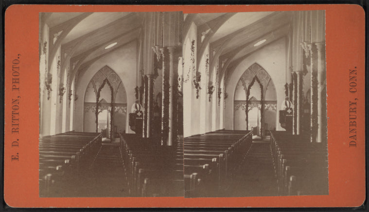 View of a garland-draped church interior.