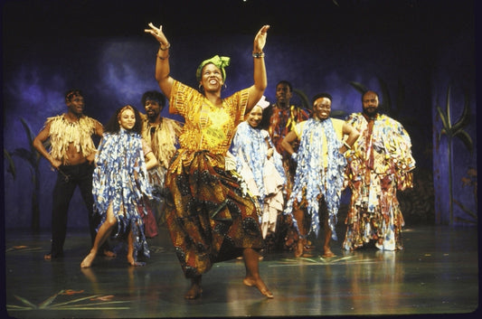Actress Kecia Lewis-Evans (C) w. cast in a scene fr. the Playwrights Horizons' production of the musical "Once On This Island." (New York)