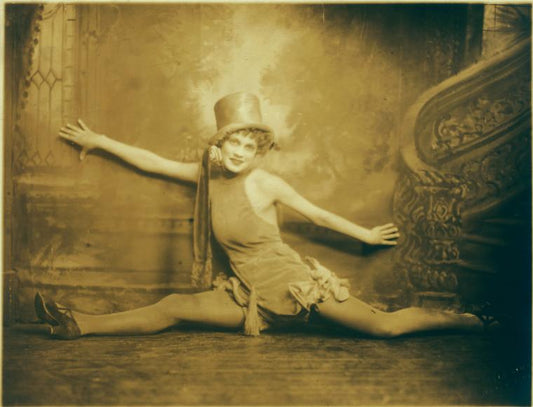 Dancer in split, wearing top hat