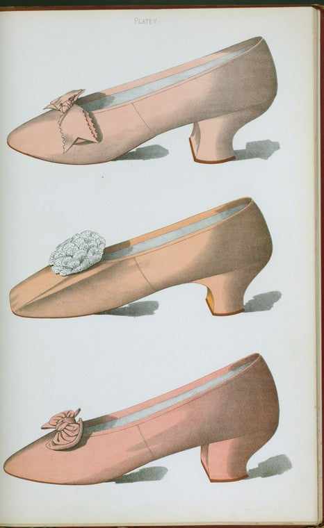 Pink kid shoe and two pink satin shoes