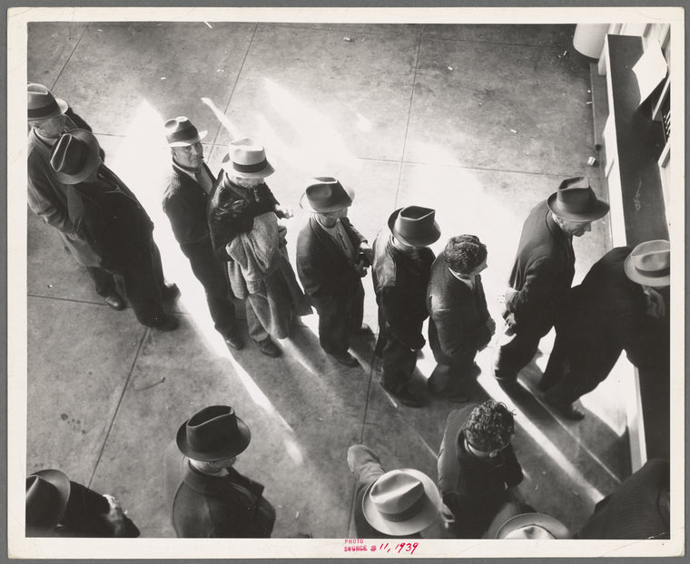 Unemployment benefits aid begins. Line of men inside a division office of the State Employment Service office at San Francisco, California, waiting to register for benefits on one of the first days the office was open