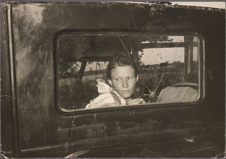 Migrant worker looking through back window of automobile near Prague, Oklahoma. Lincoln County, Oklahoma