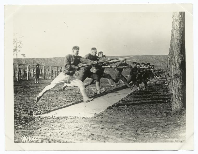 Soldiers charging with bayonets