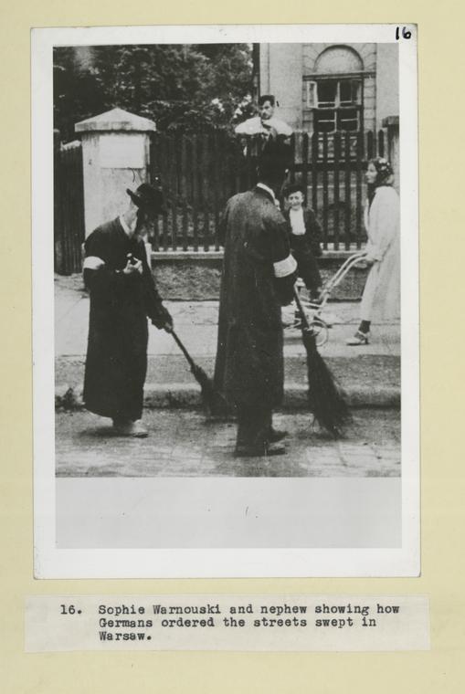 Sophie Warnouski and nephew showing how Germans ordered the streets swept in Warsaw.