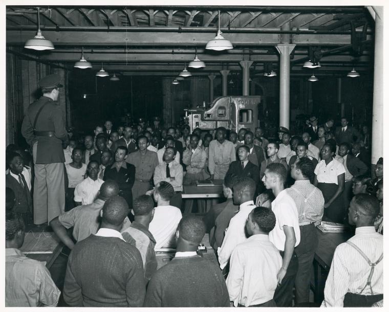 Inspection tour of defense schools in Baltimore; Lt. Harrison addressing a group of students in Defense School # 453