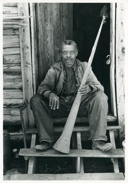 Old Negro [former slave] with horn with which slaves were called; Near Marshall, Texas.