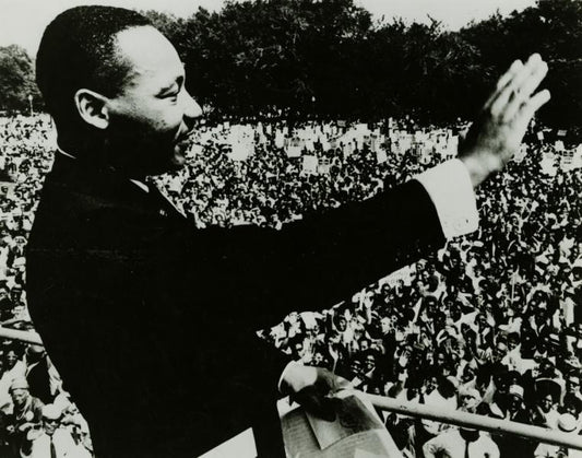 Dr. Martin Luther King, Jr. waving to the crowd from the steps of the Lincoln Memorial during the March on Washington