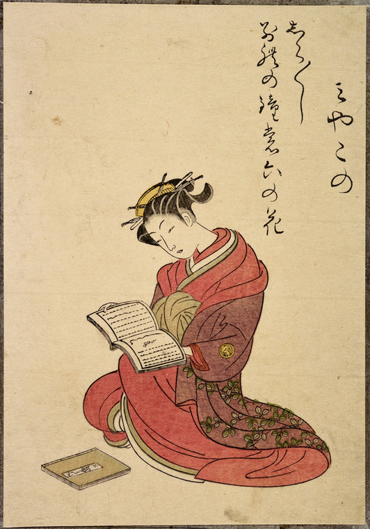 Seated lady reading book
