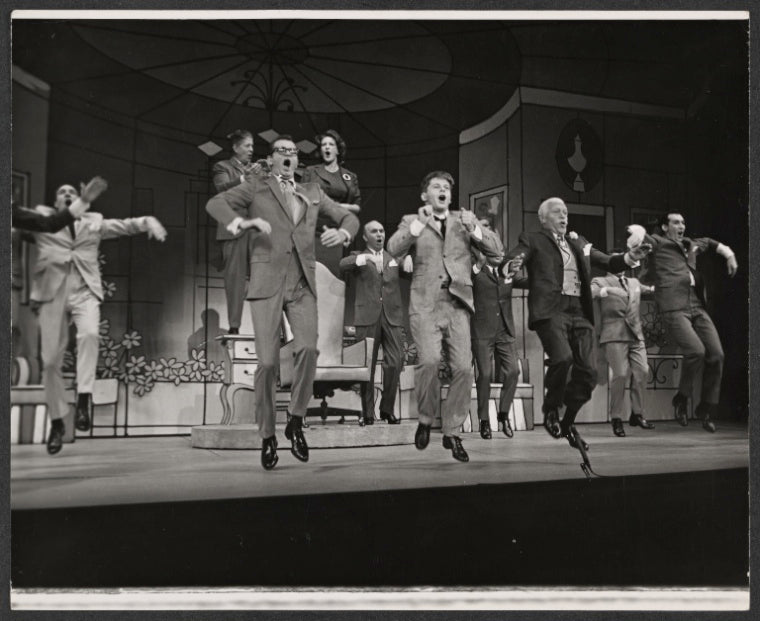 Charles Nelson Reilly, Robert Morse [center] and ensemble in the stage production How to Succeed in Business Without Really Trying