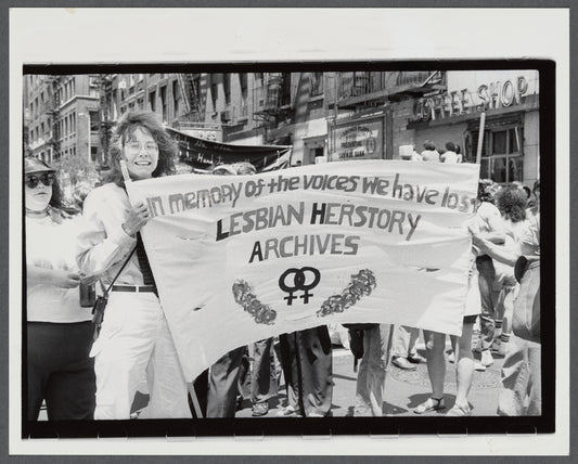 Lesbian Herstory Archives marchers with banner: Lesbian Herstory Archives