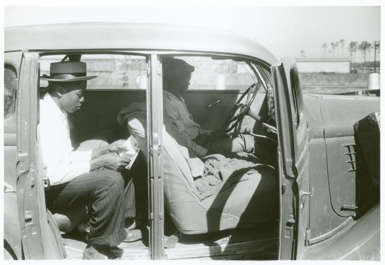Migratory agricultural workers at the Little Creek end of the Norfolk-Cape Charles Ferry. They are going to Bridgeville, Delaware to pick apples. July 1940.