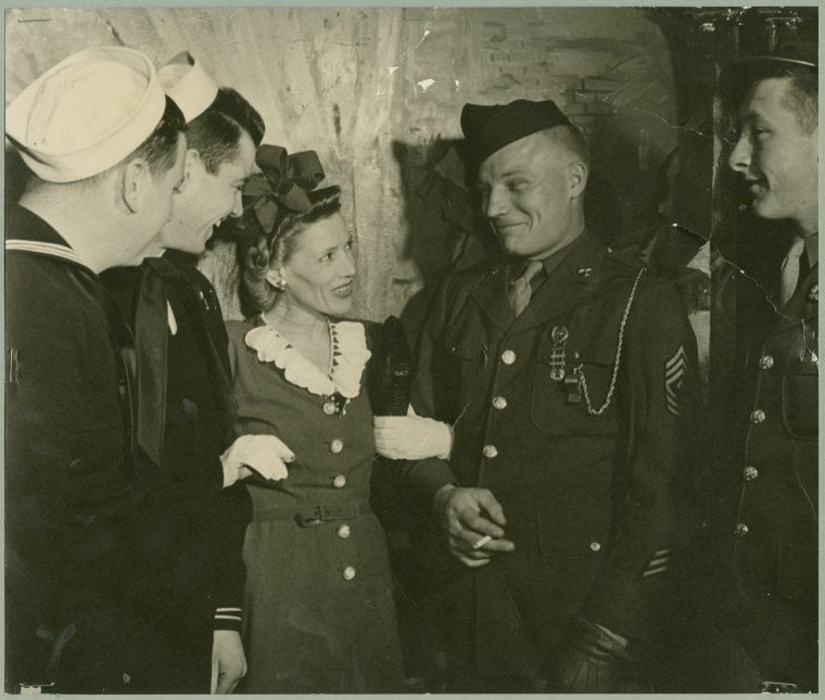 Woman with service men