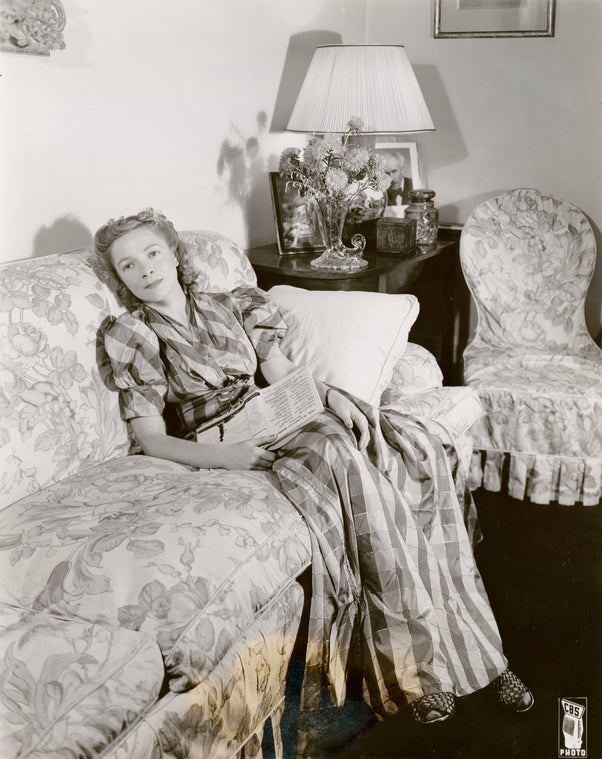 Helen Hayes, CBS star, drops her book and just takes it easy in the living room of her decorative Victorian home in Nyack, N.Y.