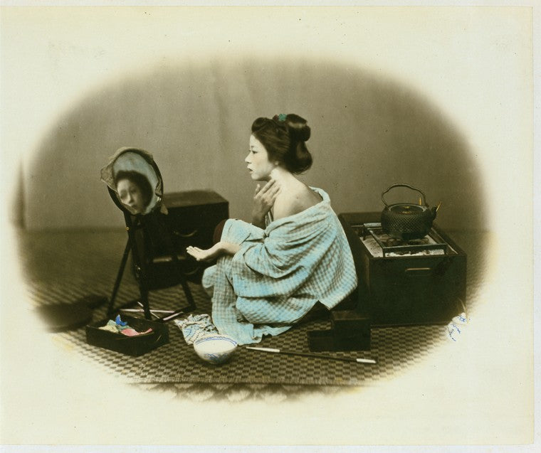 Woman using cosmetic