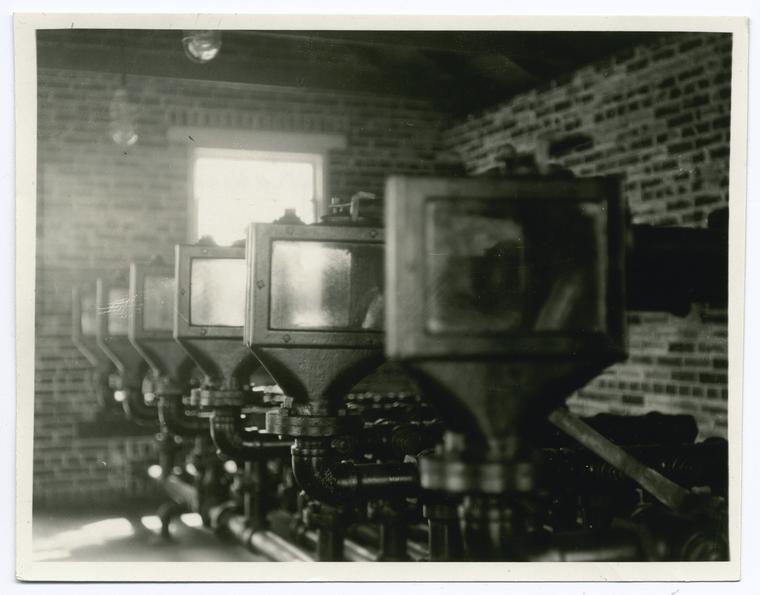 Look boxes in still house where refined products are sampled as they flow over from stills