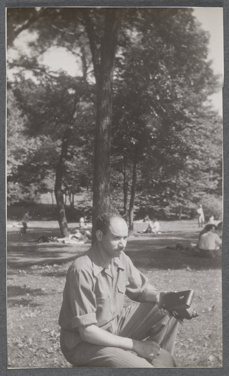 Man with camera in park