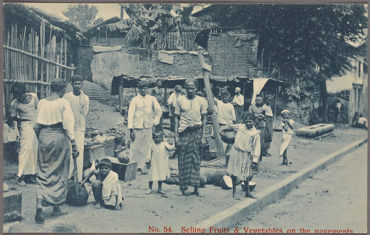 Selling fruits & vegetables on the pavement.