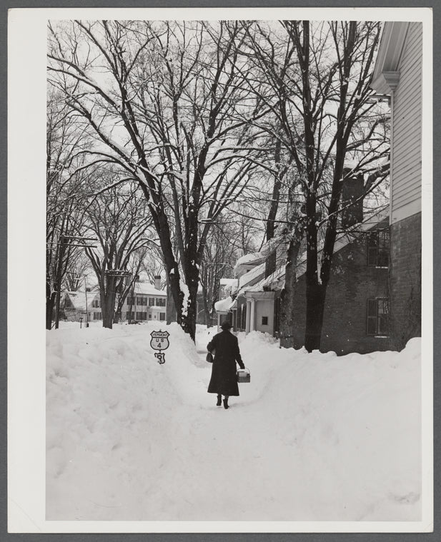 Deepest snow in years piled up beside highways and sidewalks on main street in Woodstock, Vermont