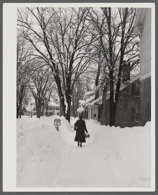 Deepest snow in years piled up beside highways and sidewalks on main street in Woodstock, Vermont