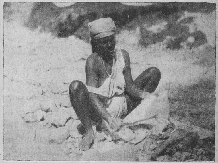 Haitian woman washing clothes in a river.