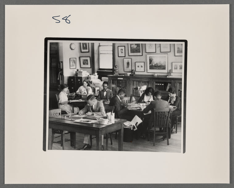 View of researchers using the Schomburg Collection, when it was the 135th Street Branch Library Division of Negro Literature, History and Prints, as it looked in 1938, with Catherine A. Latimer, reference librarian of the collection, in left background.