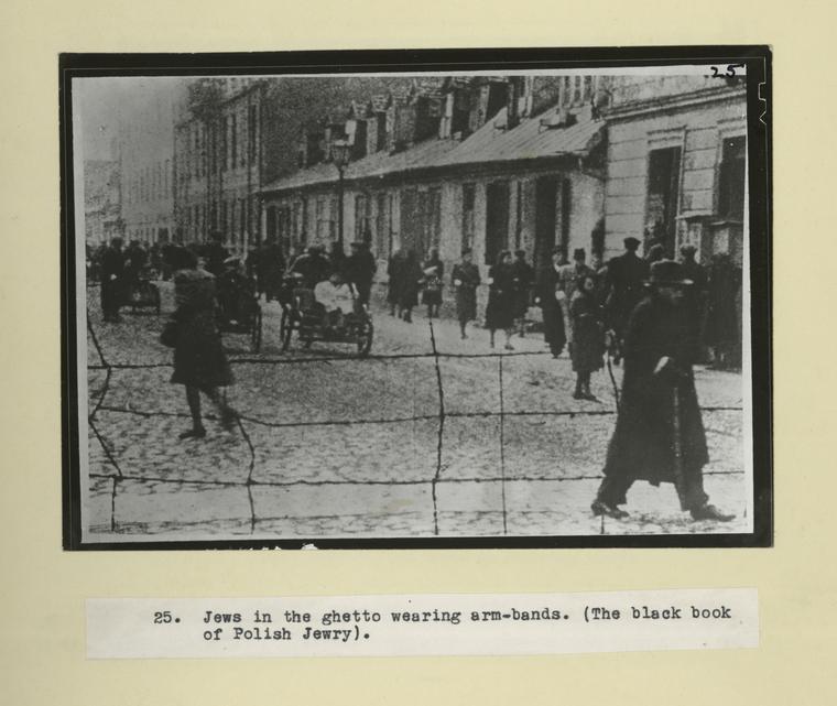 Jews in the ghetto wearing arm-bands. (The black book of Polish Jewry).