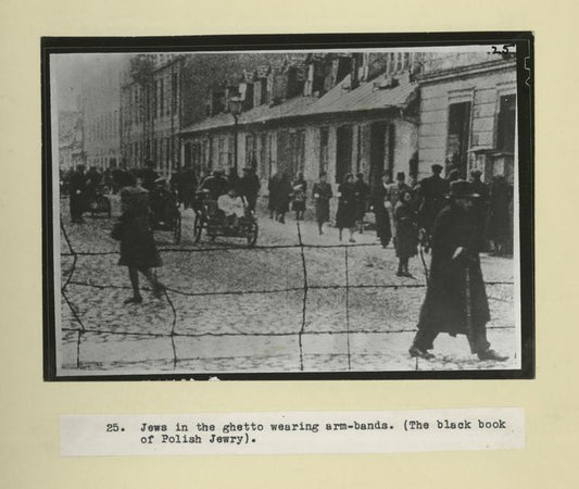 Jews in the ghetto wearing arm-bands. (The black book of Polish Jewry).