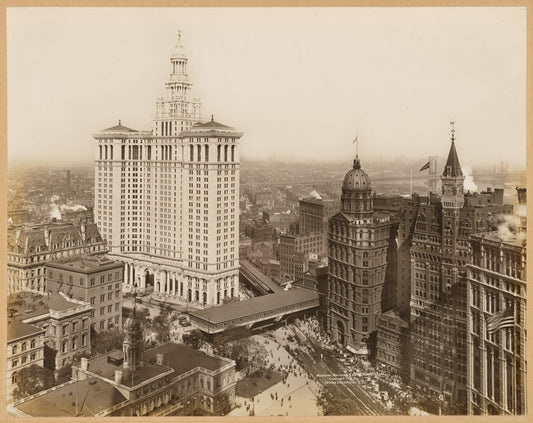 Aerial view of City Hall, Municipal Building, The World, Sun, Tribune and Times buildings; Brooklyn Bridge elevated station