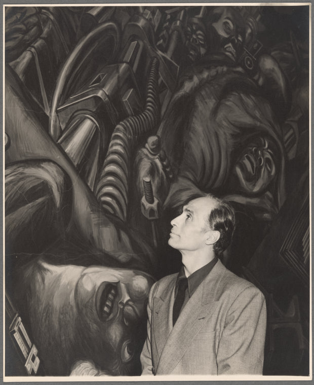 José Limón in front of the mural "Katharsis" by José Clemente Orozco at the Palacio de Bellas Artes