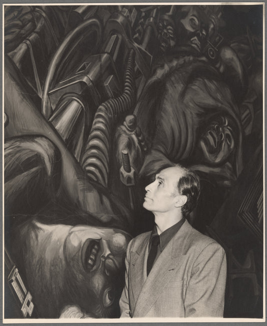 José Limón in front of the mural "Katharsis" by José Clemente Orozco at the Palacio de Bellas Artes