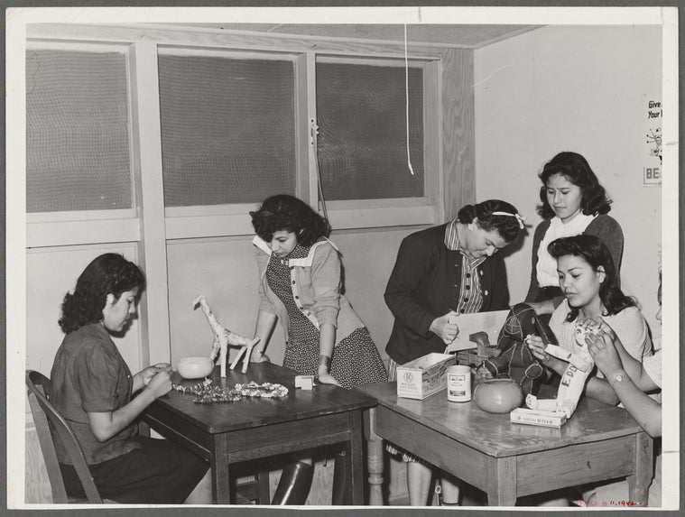NYA (National Youth Administration) girls who live at the resident center at the FSA (Farm Security Administration) farm workers' community at Eleven Mile Corner, Arizona, learn to use waste materials for toys, jewelry, etc