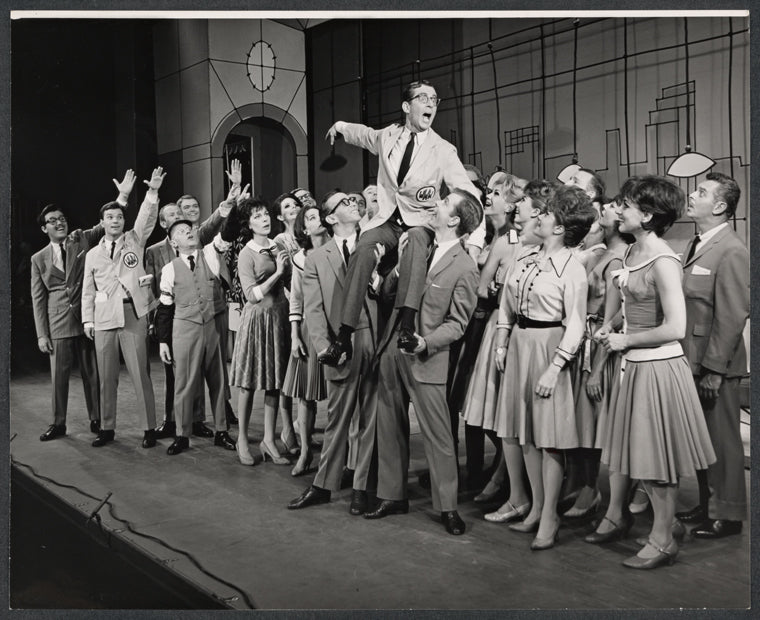 Darryl Hickman [left], Ralph Purdum [top] and ensemble in the stage production How to Succeed in Business Without Really Trying