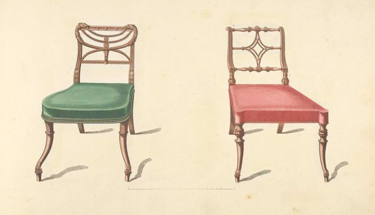 Two chairs with red, green cushions.