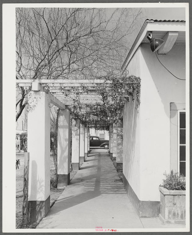 Phoenix, Arizona. Camelback Farms, FSA (Farm Security Administration) project. Open passageway of the community building