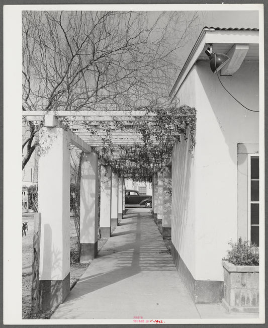 Phoenix, Arizona. Camelback Farms, FSA (Farm Security Administration) project. Open passageway of the community building