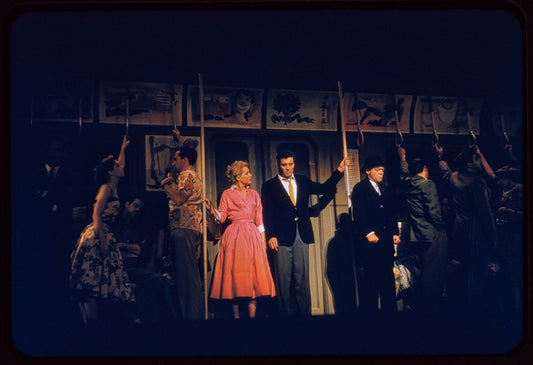 Judy Holliday, Sydney Chaplin [center] and unidentified others in the stage production Bells Are Ringing