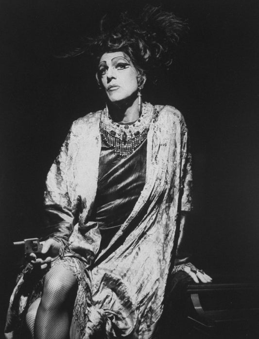 Portrait of NYC downtown actor and playwright Ethyl Eichelberger (real name: James Roy), dressed as a woman holding a gun.