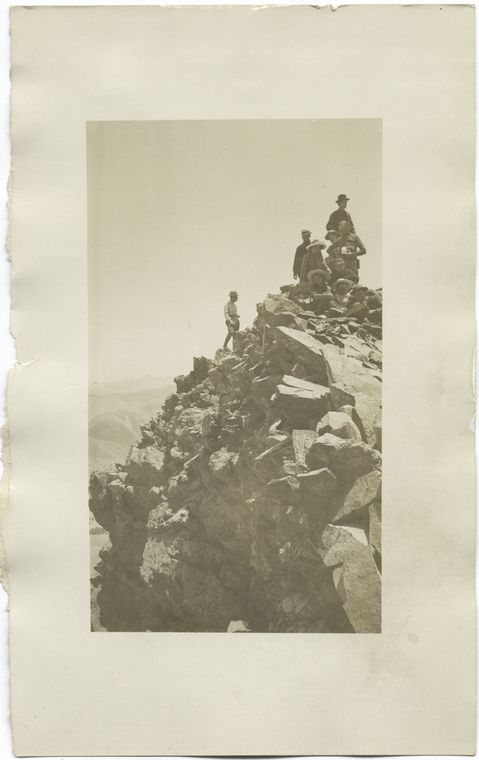 Group of mountain climbers on a peak.