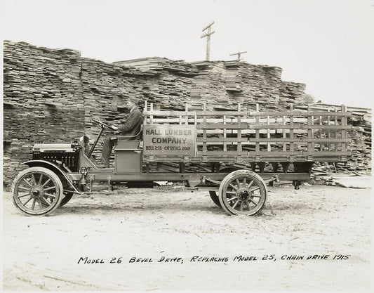Model 26 Bevel drive; replacing Model 25, chain drive 1915. [At the loading site of Hall Lumber Company].