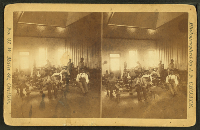 Native American students in a workshop at the United States Indian Industrial Training School.