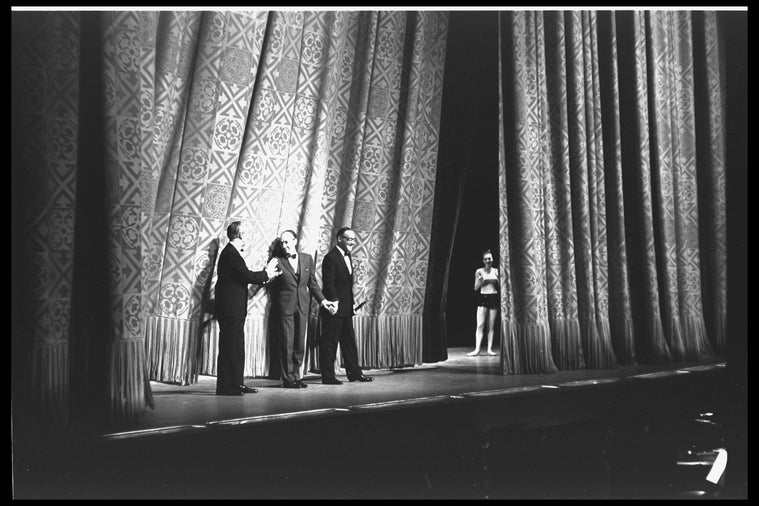 New York City Ballet production of "Clarinade"; taking a bow in front of curtain are composer Morton Gould, George Balanchine, and Benny Goodman, choreography by George Balanchine (New York)