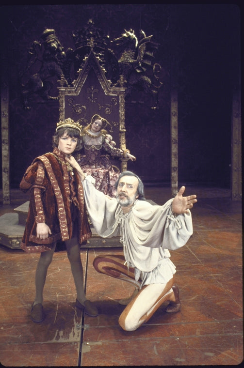 Actors (fr.) Michael John & Tom Aldredge w. (back, on throne)  Penny Fuller in a scene fr. the Broadway musical "Rex." (New York)