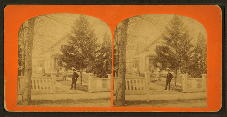 Group of people in the garden in front of their home.
