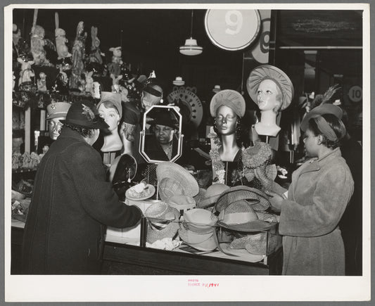 Buying hats in ten-cent store which caters to Negroes. Chicago, Illinois