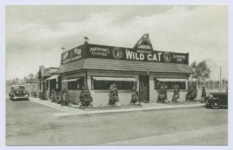 Belasco's Wild Cat (ext. with signs on building, lager beer on draught, Martinson's coffee, liquors, dinners 55 cents, 40's cars in parking lot