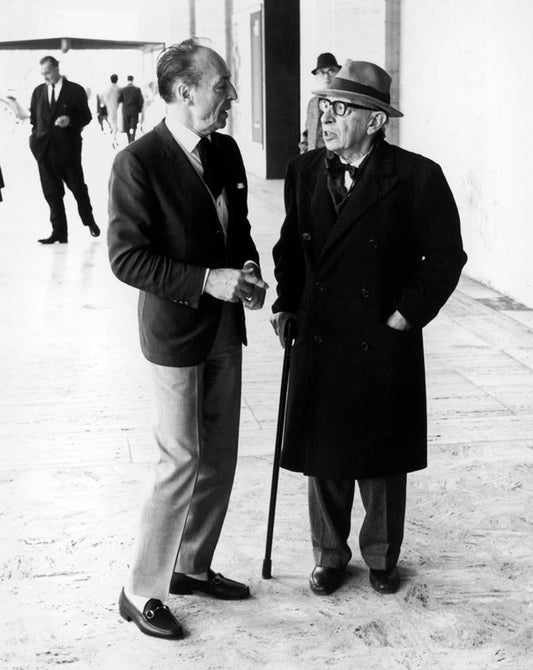 (L-R) Choreographer George Balanchine chatting with composer Igor Stravinsky outside New York State Theater.