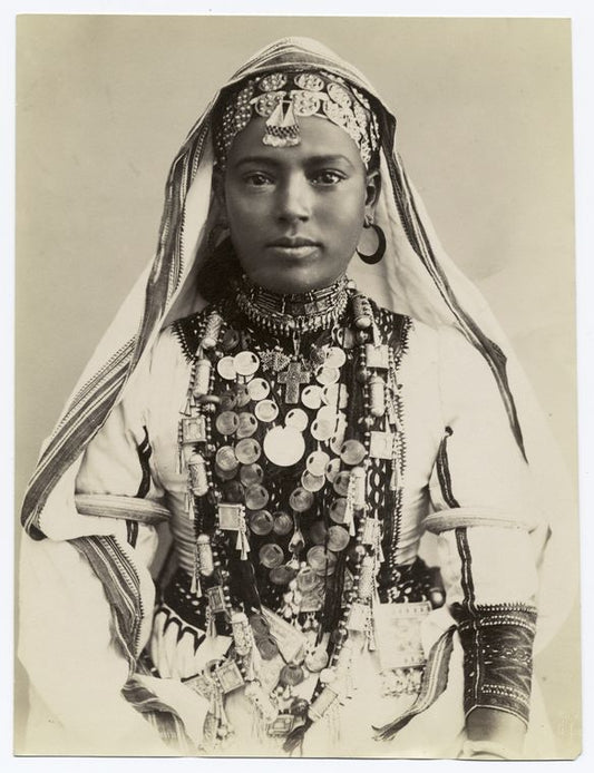 Portrait of a young woman in elaborate robes and jewelry