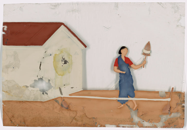 Female spinner in front of white building
