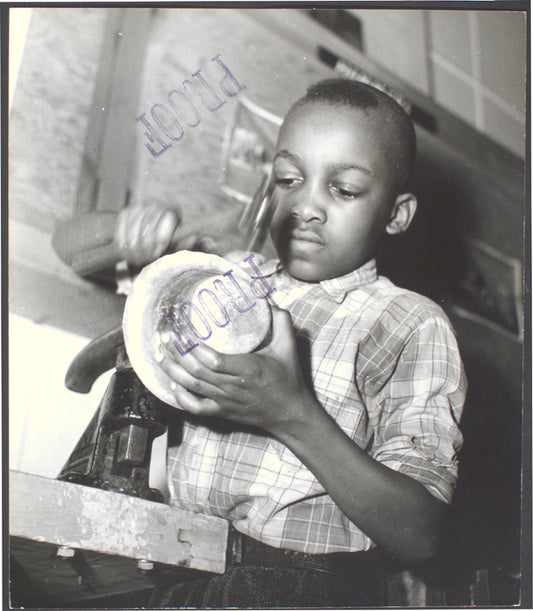 Harlem Community Art Center: student in metal craft class, 290 Lenox Avenue